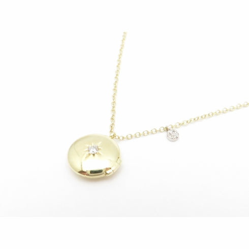 Meira t locket with Natural diamonds.  Dainty round locket with dangle .03ct tw.